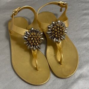 Coach Hilda gold coloredjelly thong flat sandals in W8 with floral embellishment